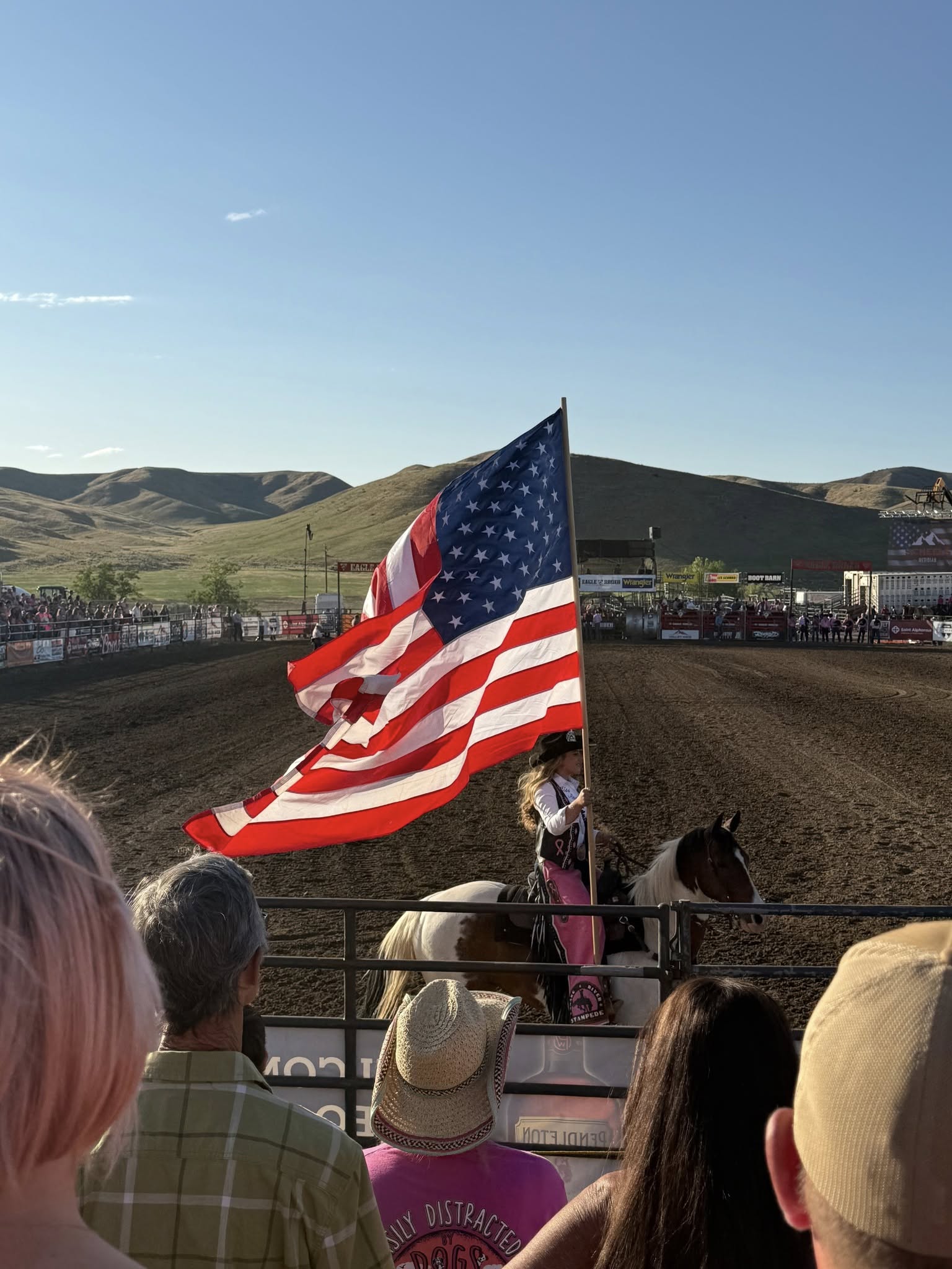 Rodeo in Idaho, American flag on horseback